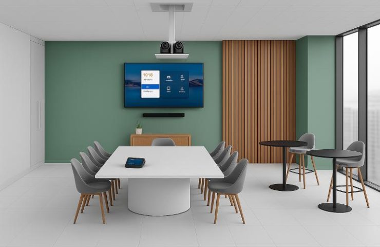 Motorized PTZ camera lift lowering from a conference room ceiling